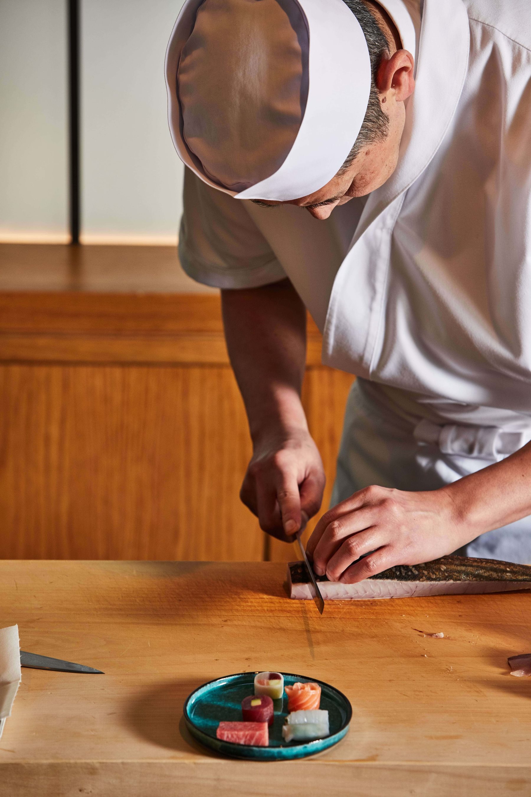chef Yoshii preparing sashimi
